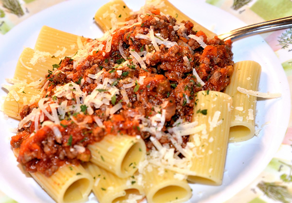 a plate of Bolognese sauce with Rigatoni pasta