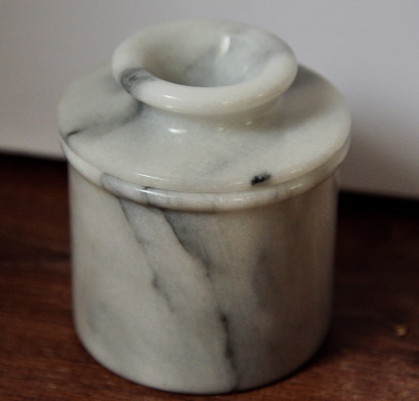 A marble butter bell closed