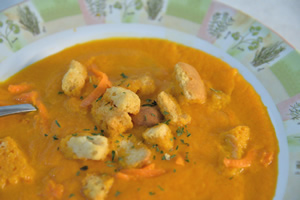 Carrot soup with croutons in a bowl