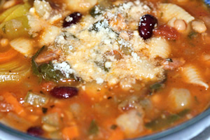 Minestrone soup with shredded Parmigiano Reggiano cheese