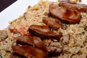 A white serving platter containing Chinese Barbecued Pork Fried Rice