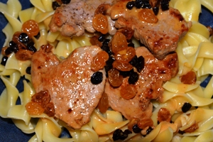 Pork Medallions with cherry balsamic vinegar, raisins and currants on a bed of egg noodles