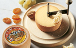 Tête de Moine cheese mounted on a cheese curler
